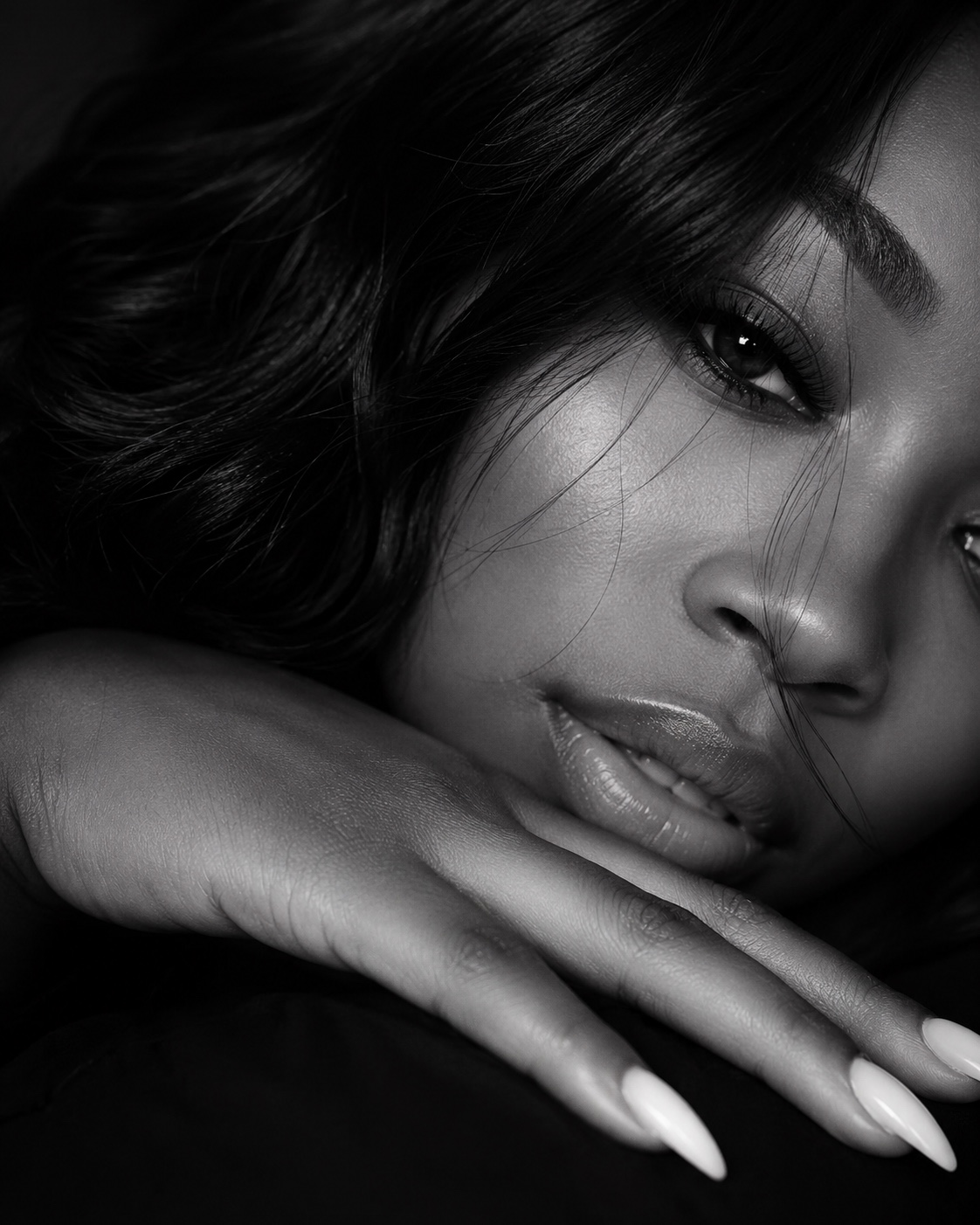 Black-and-white luxury wellness portrait representing quiet, reflection and peace